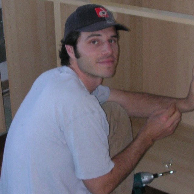 Josh Steinman setting cabinets, 2005